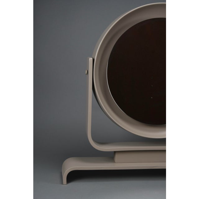 Italian postmodern vanity mirror in taupe lacquered wood, tilting, 1980s a sculptural table mirror that captures the...