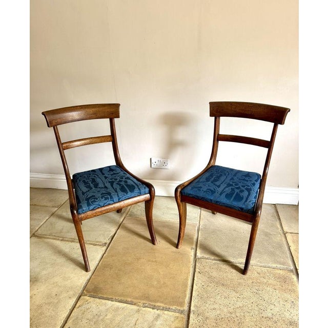 Quality pair of antique Regency mahogany chairs, having a quality pair of chairs with a curved top rail and centre splat...