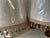 Pair of white Lamp Shades decorated with fringed trim.