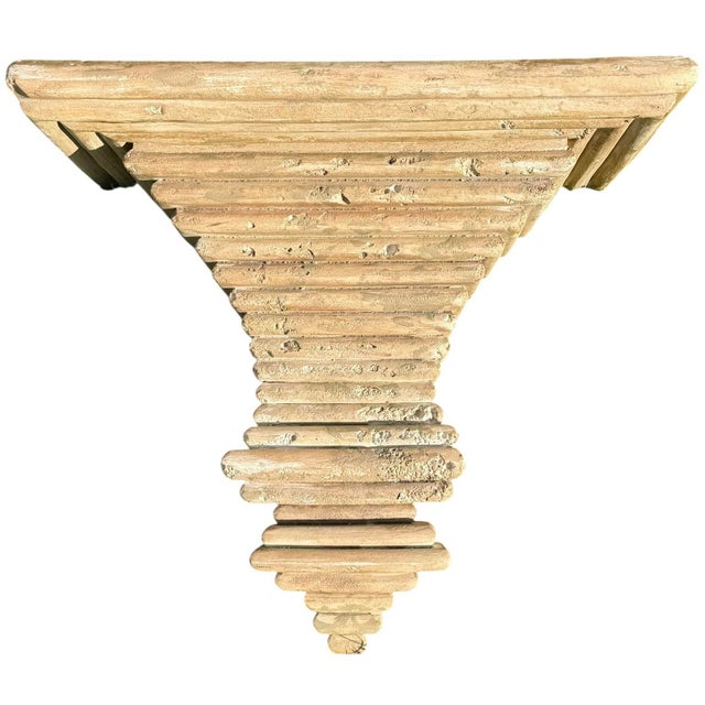 Striking vintage cast architectural wall bracket featuring a dramatic stepped form and beautifully weathered surface....