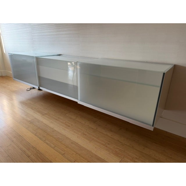 **Volare Illuminated Glass Credenza by Team By Wellis (Switzerland)** A rare and striking Volare credenza by exceptional...