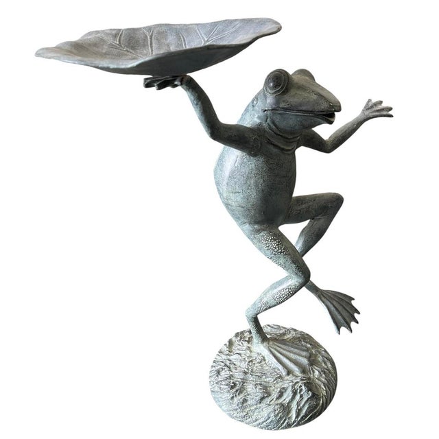 An enchanting and highly charismatic vintage verdigris bronze garden sculpture depicting a whimsical, stylized dancing...