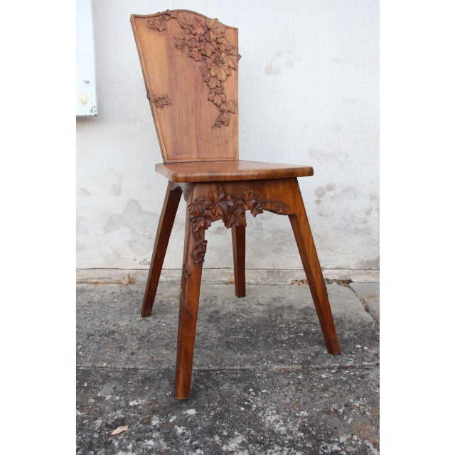 Superb Art Nouveau chair in light walnut carved with ivy leaves. Beautifully crafted. Cabinetmaker identified.