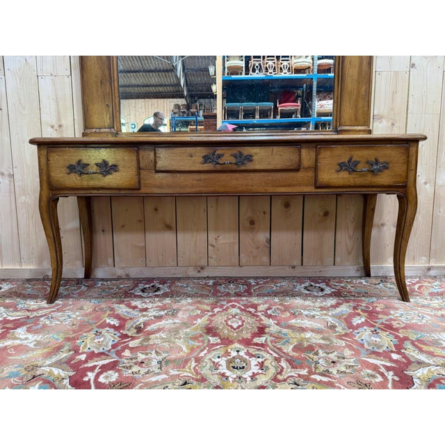 A solid oak console and mirror set, combining two distinct 19th-century styles. the louis xv style console rests on four...