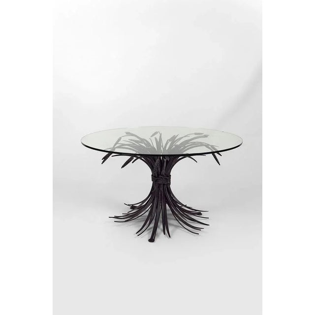 Coffee table with ears of wheat. Patinated metal sculpture. Circular glass plate. In good condition. Chips on the glass,...
