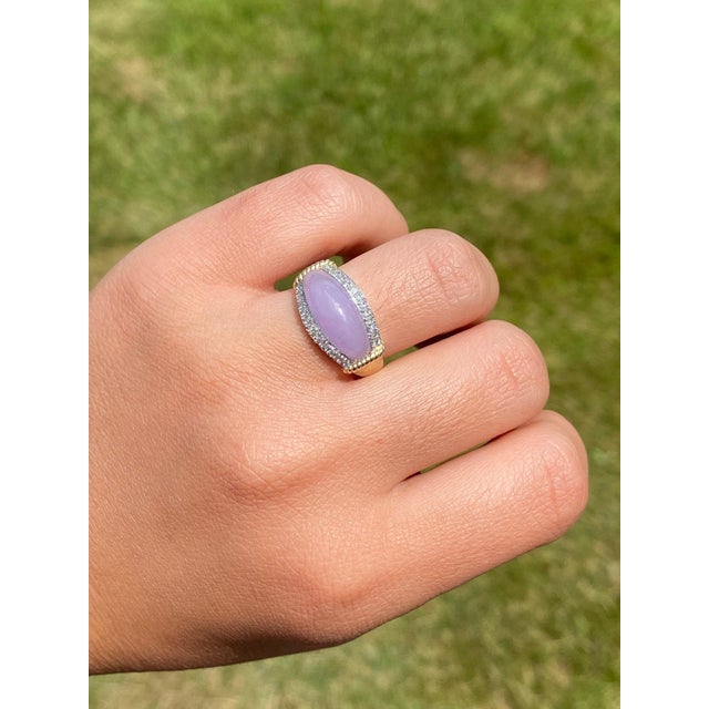 The Turlock: Natural Lavender Jadeite Jade Ring with Diamonds. The ring features a central modified saddle shaped lavender...