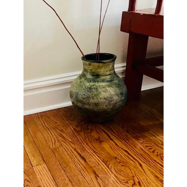 Unique ceramic decorative pot, glazed and etched. Great condition. Been in storage. Measures 14.5" tall; 12" diameter at...
