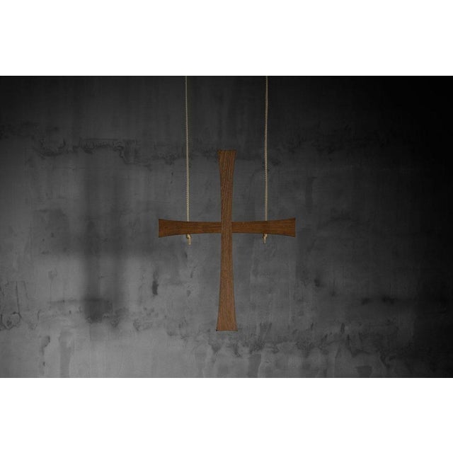 This solid wenge wooden cross was designed by Jan de Jong in 1964 for the Sint-Willibrorduskerk in Almelo and represents...