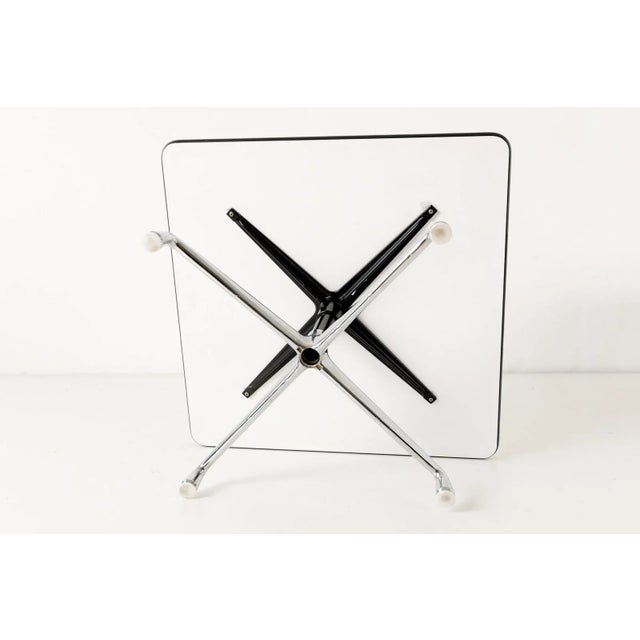 To match the chairs and armchairs of the ALU Group, Charles and Ray Eames also designed Side tables. Our copy bears the...