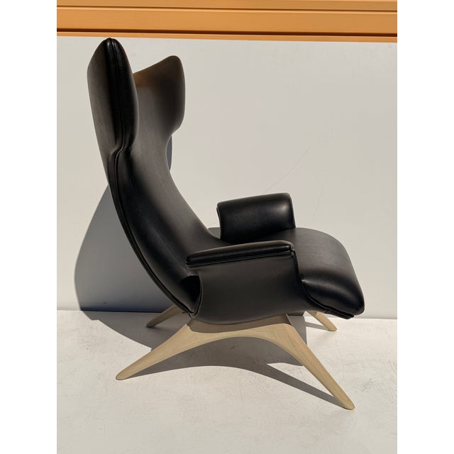 Vladimir Kagan Ondine lounge chair in rare white oak frame and in Holly Hunt soft black leather upholstery. This is a...