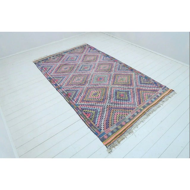 This beautiful, vintage, handwoven kilim is approximately 60 years old. It is handmade, of very fine quality hand spun...