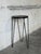 This tall pedestal features a distinctive round top suspended on an airy base. The clean silhouette beautifully showcases...