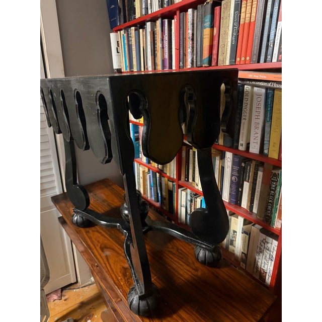 Gloss black with a faux tortoiseshell top this handmade table would do nicely in your sitting room as a side table or on...