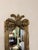 Elegant pair of French-style pier mirrors, beautifully decorated with foliage and scroll detailing. Each mirror features...