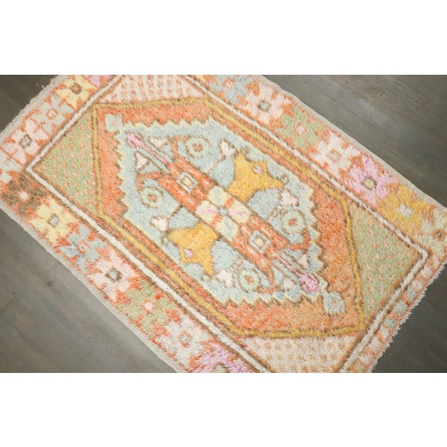 A vintage turkish small anatolian rug