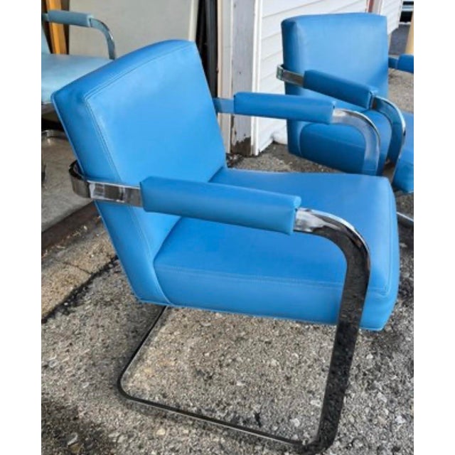 A striking and rare set of six mid-century modern cantilever armchairs designed by master of American modernism, Milo...