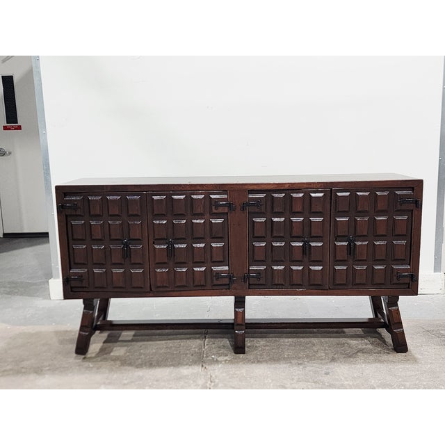 Antique Early 20th Century Northen Spain Catalan walnut credenza or server, featuring carved front doors with hand forged...