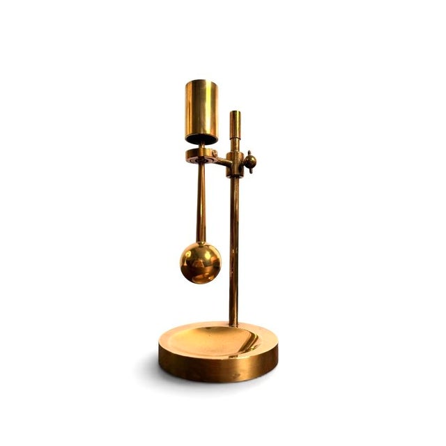 Poul kralund adjustable brass candlestick produced in denmark during the mid-20th century. executed in brass with an...