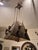 Impressive early 20th century light fixture handcrafted in hammered copper , with ceiling crown and four copper rods...