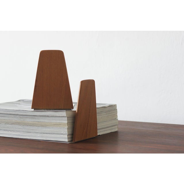 This pair of bookends designed by Kai Kristiansen embodies the essence of Danish modernist design—an everyday object that,...