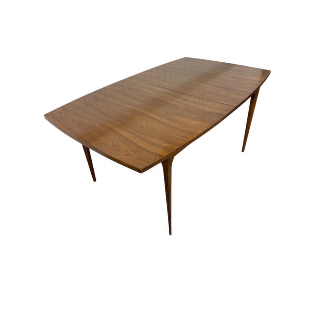 Bring timeless mid-century elegance into your dining space with this stunning Broyhill Brasilia Walnut Dining Table, circa...