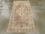 An antique Turkish Oushak throw rug. The look is generally subdued on this western Turkish village scatter with a tan...