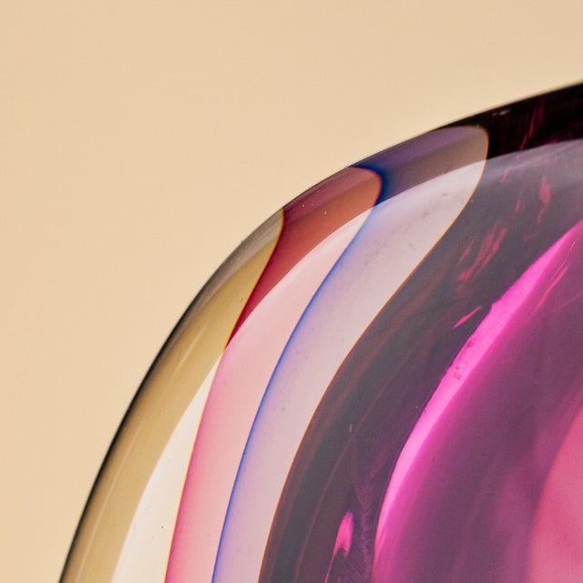 This distinguished, flat, ovoid vase embodies the mastery of vetreria artistica oball, a firm founded in murano by the...