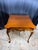 Curator Notes: A marvel of space-saving historical utility, this charming vintage Queen Anne style flip-top table...