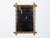 A French Turn of the Century walnut faux bamboo mirror from circa 1900 with light brown color and intersecting corners....