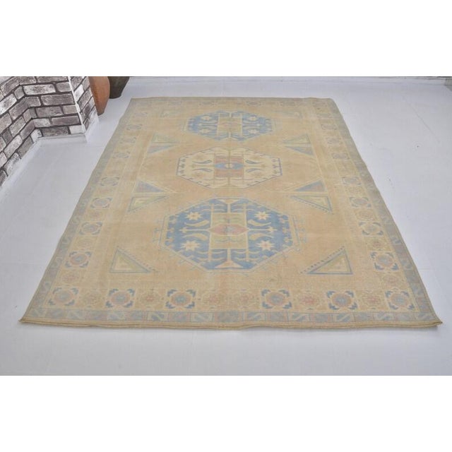 Textile Vintage Anatolian Wool Area Rug, Light Sand Field With Soft Blue Geometric Medallions For Sale - Image 7 of 10