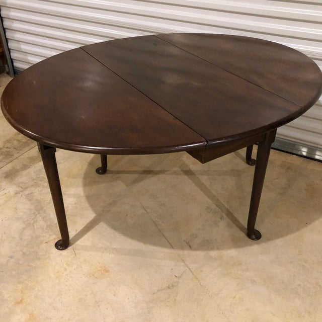 Georgian Queen Anne style oval mahogany drop leaf table with pad feet. Great for extra dining or serving. Center or entry...