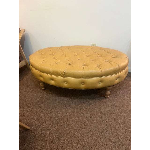 Large leather tufted ottoman Has a slight scuff on one side please see the pictures also has a few very minor spots on...