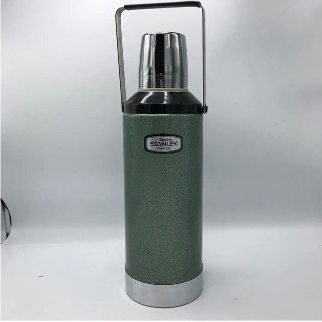 A handsome example of classic American industrial design, this 1984 Aladdin Stanley A-945DH two-quart vacuum bottle...