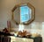 Striking vintage gilt faux-bamboo wall mirror by Carolina Mirror Company, featuring a distinctive elongated octagonal form...