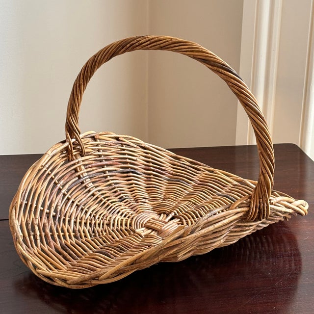 A truly exquisite flower gathering basket from the mid- to late-20th century. Love the graceful profile of this basket...