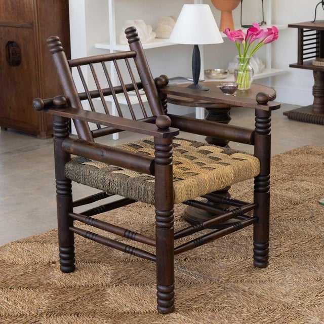 Stunning 1940s French oak and woven armchair by Charles Dudouyt. Beautiful carved wood detail throughout with intricately...