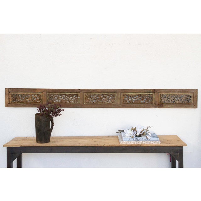 Invite a piece of profound history and breathtaking artistry into your home with this magnificent antique, finely carved...