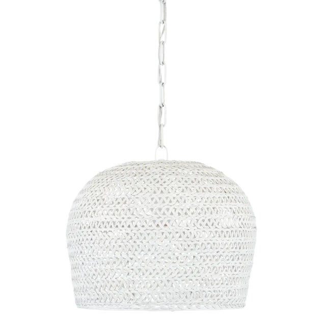 The Piero Small Chandelier may appear to be woven from a natural plant material, but it is made of iron in a white finish...