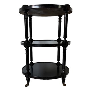 1960s Hollywood Regency Black Ebonized Three-Tier Side Table on Brass Casters For Sale