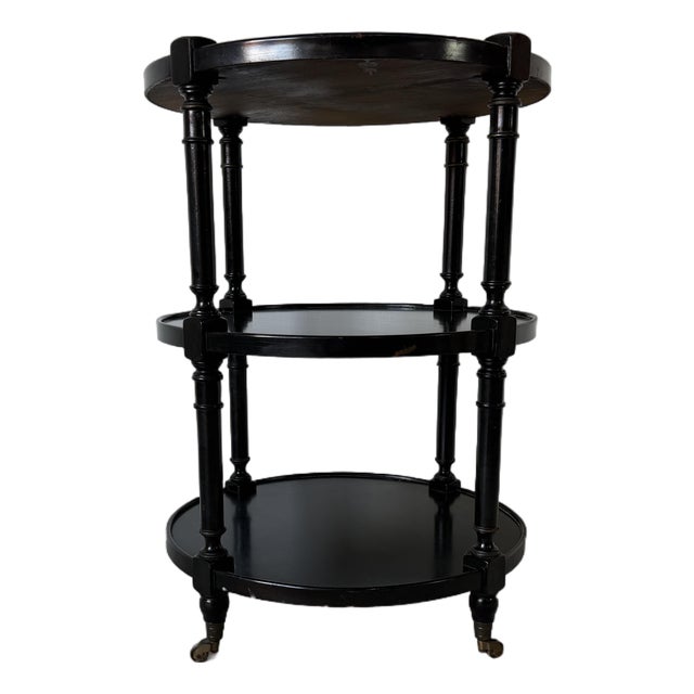 1960s Hollywood Regency Black Ebonized Three-Tier Side Table on Brass Casters For Sale