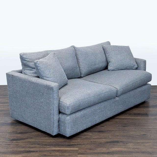 This Crate and Barrel 3-seat sofa features a clean, modern design in a versatile gray fabric. The sofa includes plush back...
