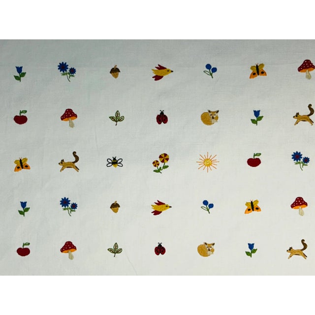 A very cute embroidery on a white cotton-linen ground of flora, fauna, woodland creatures in an endless group of colors....