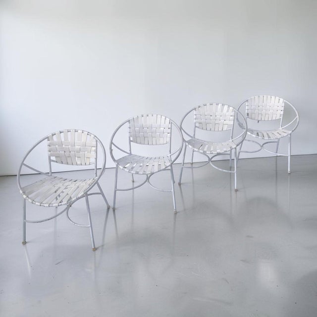 Beautiful 1960s Mid-Century Modern wrought iron patio set. This set of 4 chairs and table have amazing wrought iron frame,...