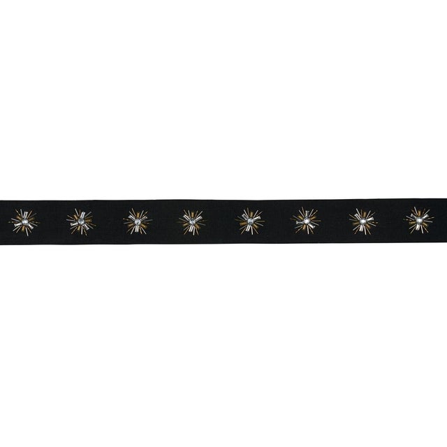 Constellation Beaded Tape in linen features oxidized beads at the center of elegant starbursts, hand-embroidered in...