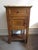 Charming bedside table made of solid wood with a light apricot-beige marble top, circa 1900, in a simple French country,...
