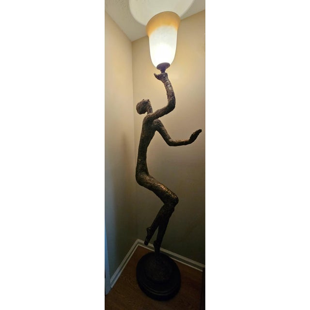 Striking life-size sculptural floor lamp in the style of Alberto Giacometti. Features an elongated abstract human form...