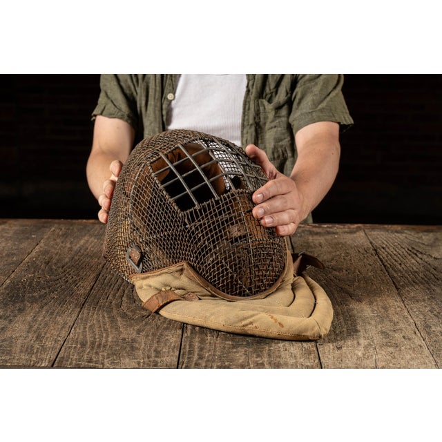 Wire training mask with padded canvas bib, used for bayonet instruction during WWI. This rare protective mask was employed...