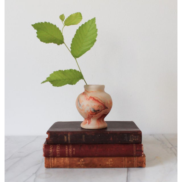 Vintage Nemadji pottery bud vase, characterized by its distinctive swirled patterns and unglazed finish. Nemadji Pottery...