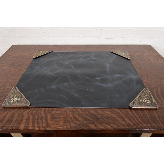 A gorgeous set of four Art Deco or Arts & Crafts period silvered bronze and abalone blotter corners, with a custom blue...