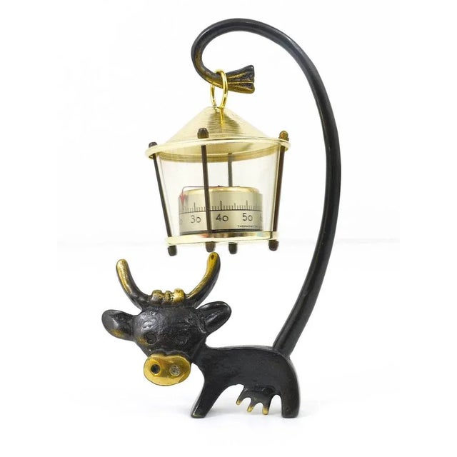 A charming Austrian desk thermometer, consisting of a nice cow figurine and a lantern-shaped thermometer. A very humorous...